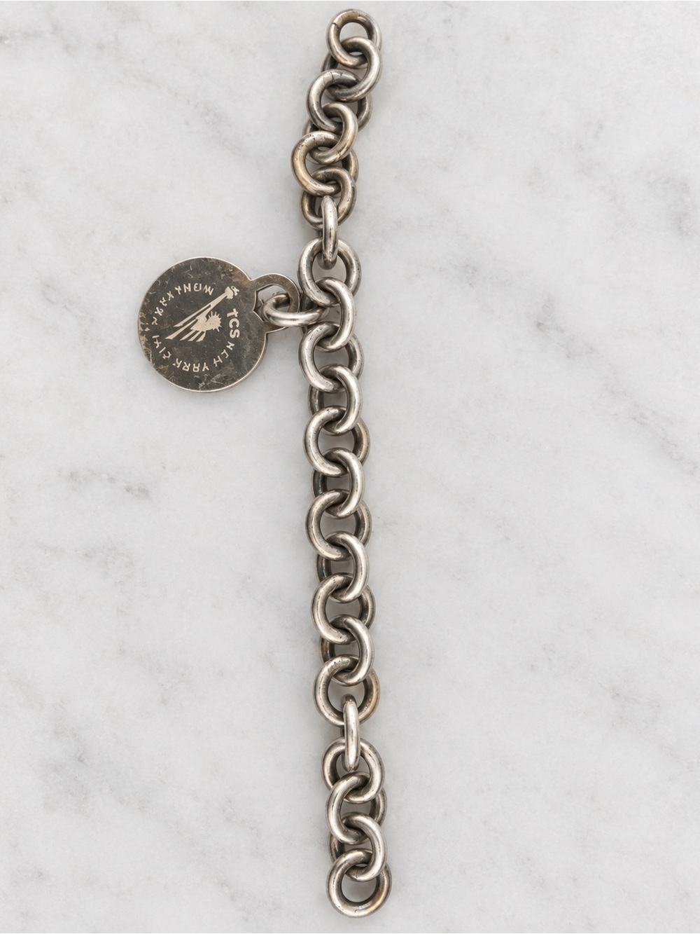 Tiffany and Co bracelet with NYC marathon apple charm